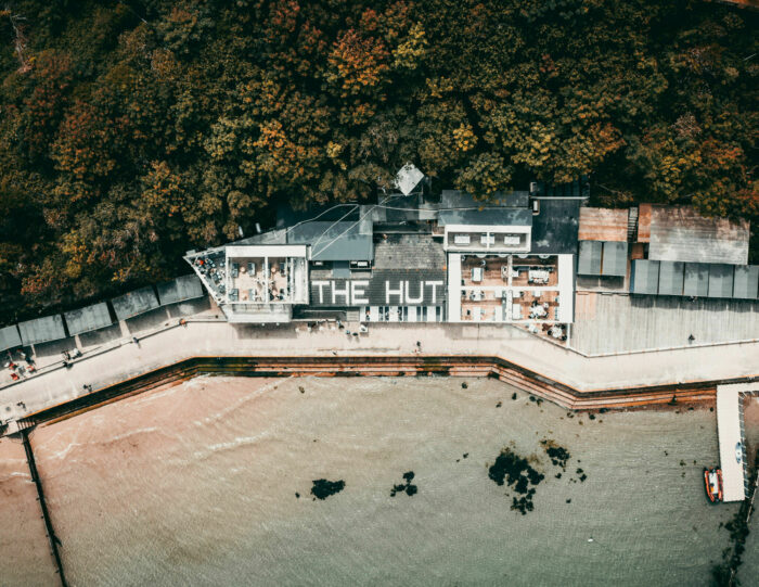 The Hut restaurant and Colwell Bay on the Isle of Wight, accessible by yacht charter from Poole